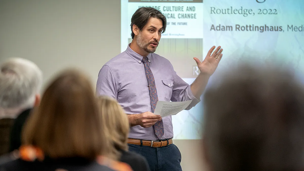 Adam Rottinghaus presents a talk on his book during last year's New Books at Miami event.